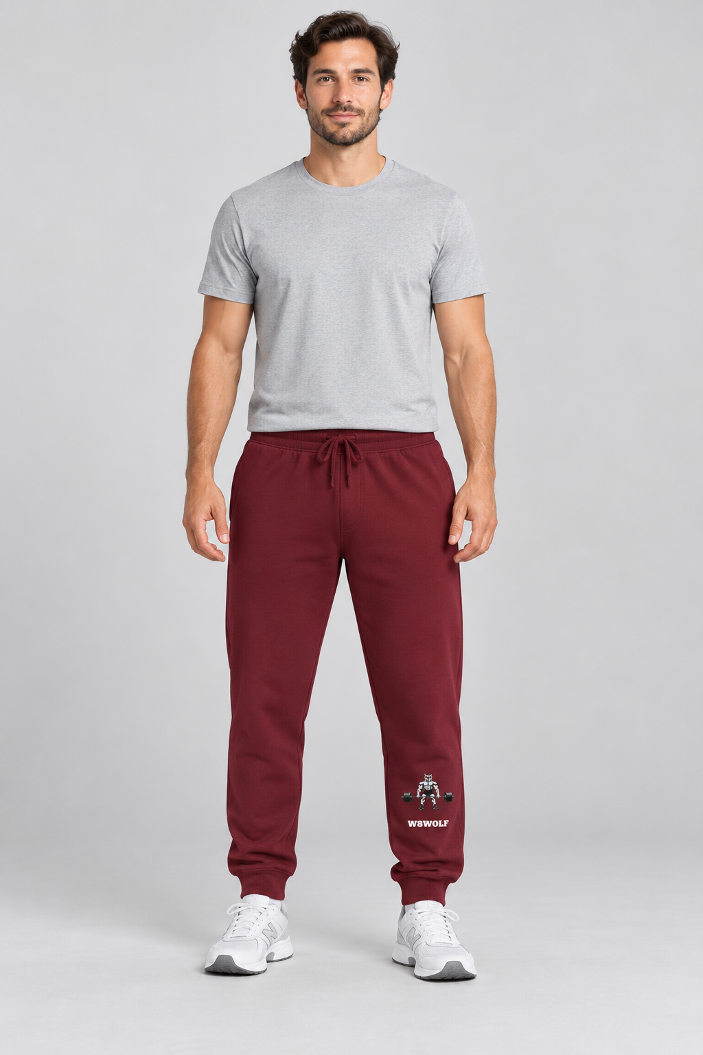 AI-generated original adult model visualization wearing Maroon W8WOLF Iron Deadlift Fleece Sweatpants with lower left-leg red-eyed wolf and separate white wordmark. Original supplier garment views retained; accompanying shirt and shoes are styling only.