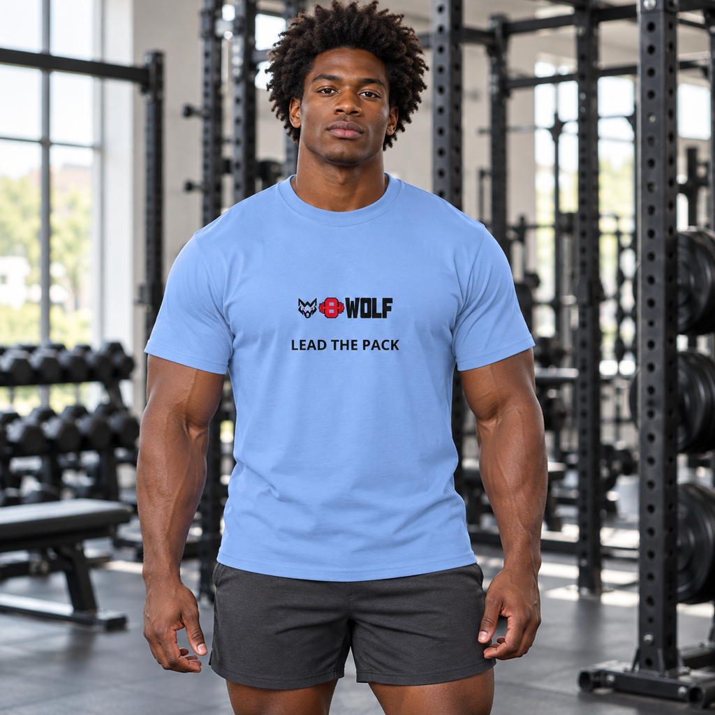 AI-generated original adult male bodybuilder wearing Carolina Blue W8WOLF Lead the Pack DryBlend Sports Tee in an urban gym. Original compact wolf red barbell8 WOLF and LEAD THE PACK artwork retained. Shorts styling only; other color supplier images retained.