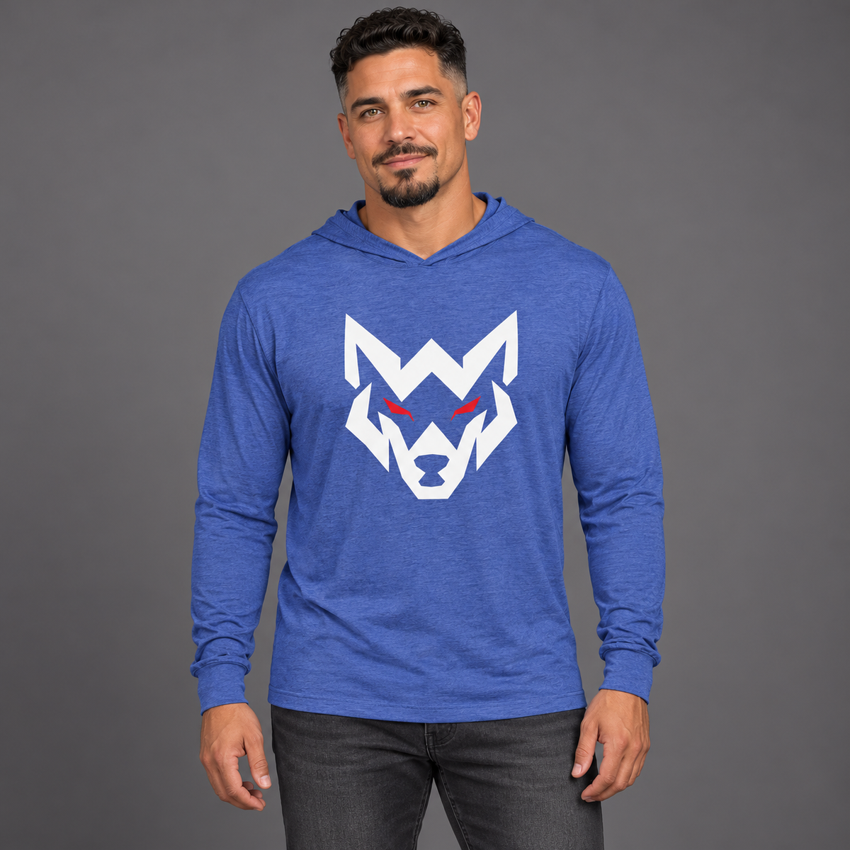AI-generated original adult model visualization wearing Heather True Royal W8WOLF Oversized Wolf Hooded Long-Sleeve Tee with original white wolf and red eyes. Lightweight tee construction retained; original supplier views of all colors retained. Jeans are styling only.