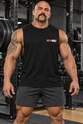 AI-generated original adult tattooed male bodybuilder wearing Black W8WOLF Essentials Left Chest Muscle Shirt in an urban powerlifting gym. Actual sleeveless construction and small original white wolf red eyes red barbell8 WOLF chest mark retained. Shorts styling only.