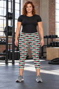 AI-generated original adult female strength athlete wearing W8WOLF Mint Monogram Capri Leggings in an urban gym. Mint mid calf cut and original black wolf red barbell8 WOLF horizontal repeat retained. Black tee and gray shoes styling only.