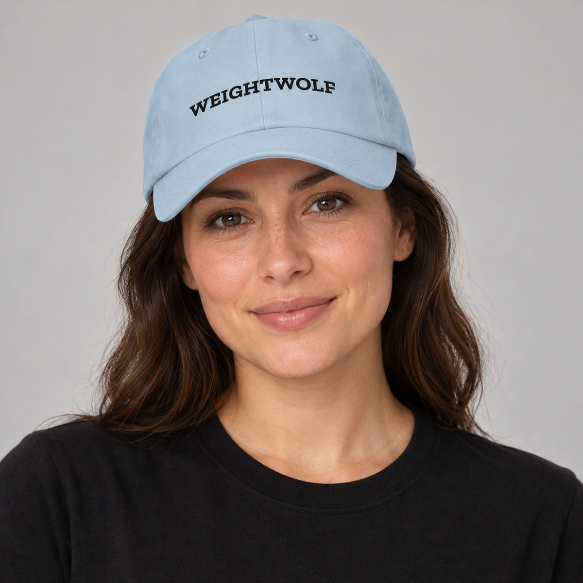 AI-generated adult model visualization wearing the Light Blue WEIGHTWOLF Serif Classic Dad Hat with black front print; original supplier images show all five available colors.